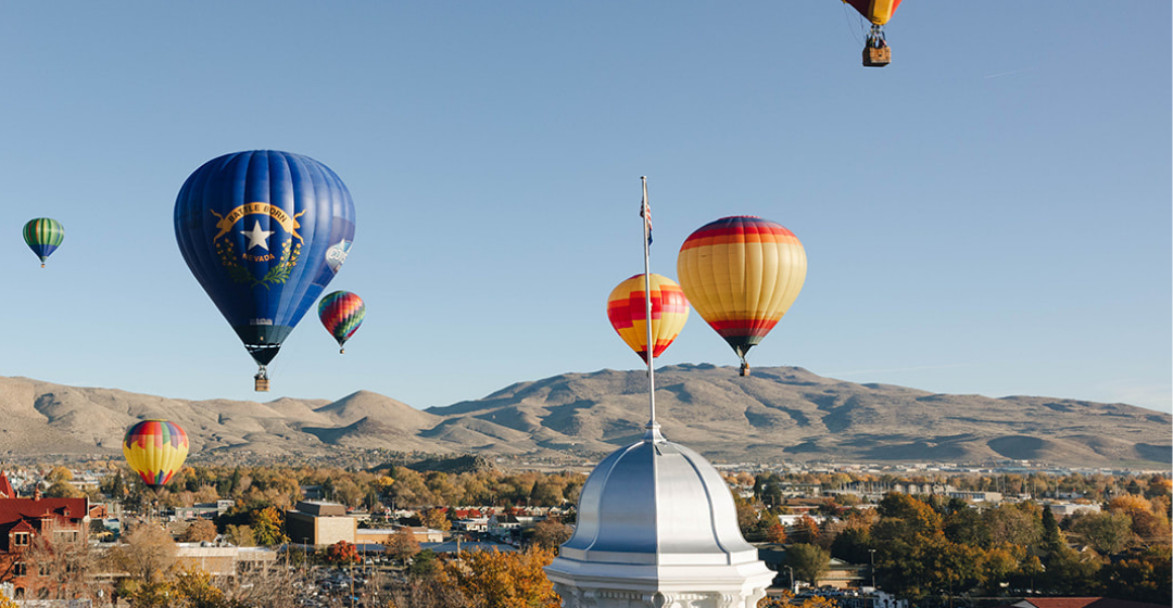 Carson City Capitol Dome centered around fall trees and hot air balloons
